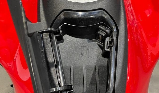 The gas tank from the 2021 Ducati Multistrada V4S with the cell phone pocket open.