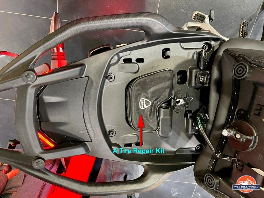 The Ducati Multistrada V4S has a tire repair kit under the rear seat from factory.