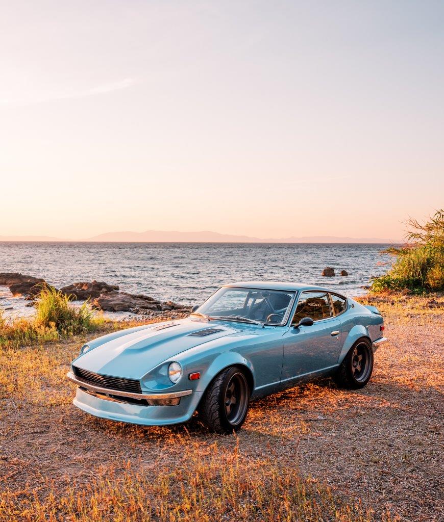 Datsun 240Z on a beach at sunset in Southern Japan