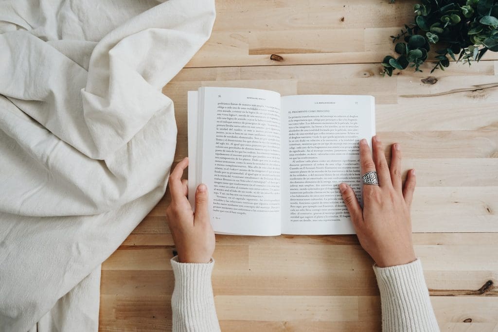 Reading book on top of table