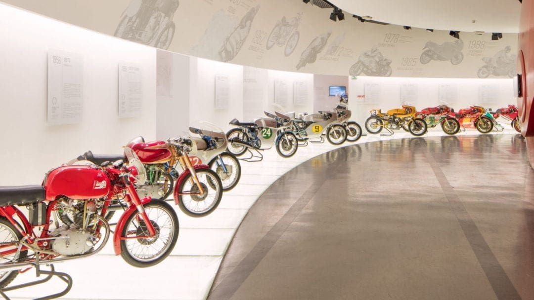 A row of Ducati motorcycles at the Ducati Museum in Bologna, Italy