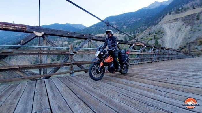 Riding over a wooden bridge on my KTM 790 adventure motorcycle.