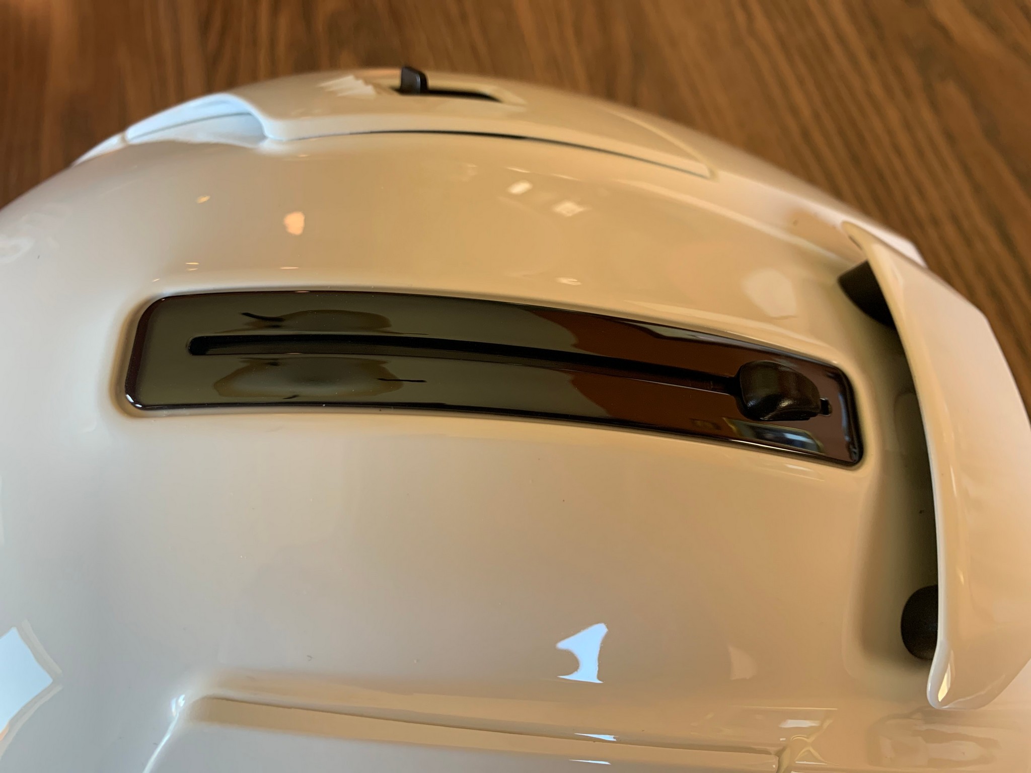 Sun shield slide mechanism on top of helmet