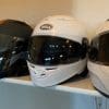 Motorcycle helmets on a shelf