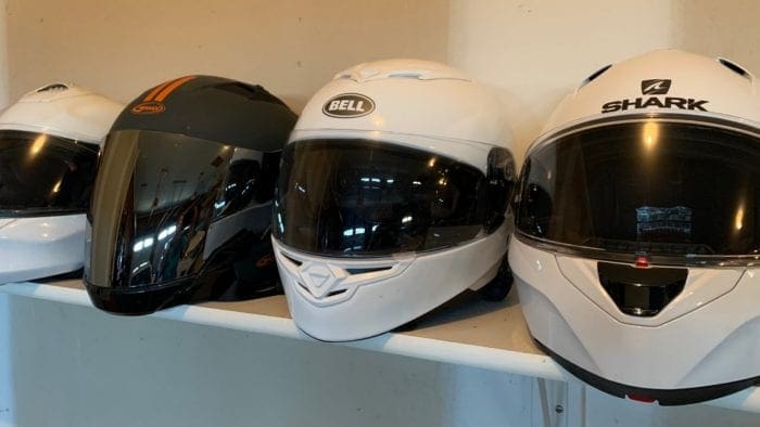 Motorcycle helmets on a shelf Motorcycle helmets on a shelf