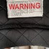 The interior warning label of a Simpson Speed Bandit Helmet