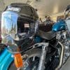 Simpson Speed Bandit helmet sitting on the back of a Harley Davidson