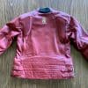 Rear view of Phoenix jacket on table