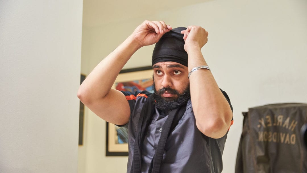 A Canadian Sikh trying out the Tough Turban