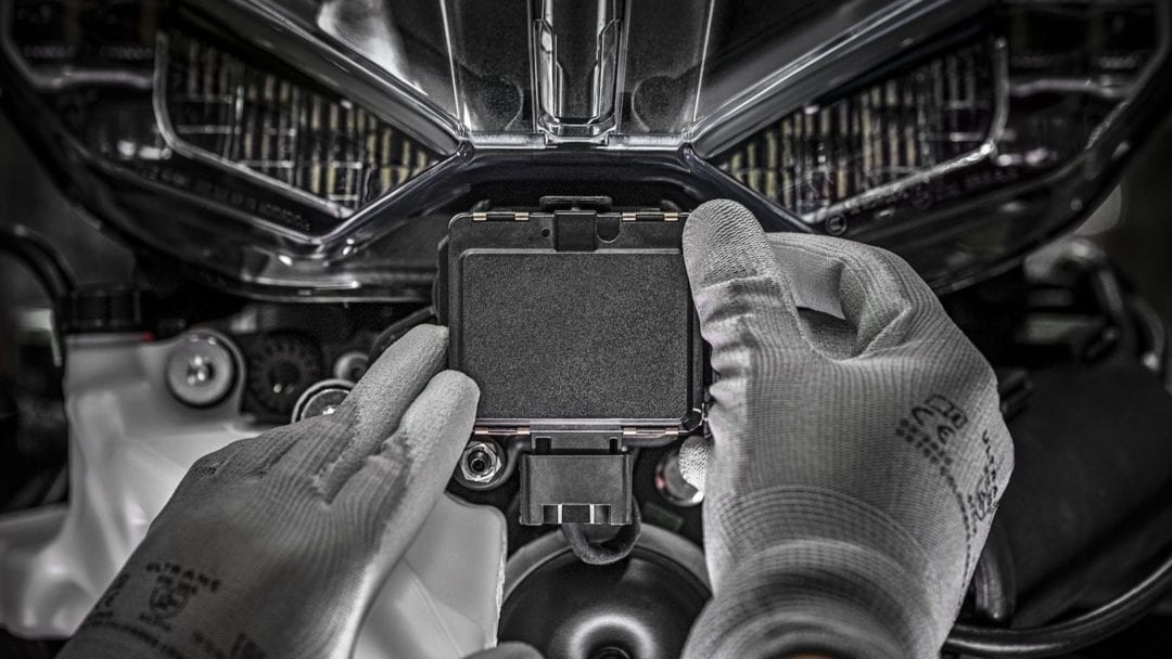 a worker installing the front and rear detection aid system