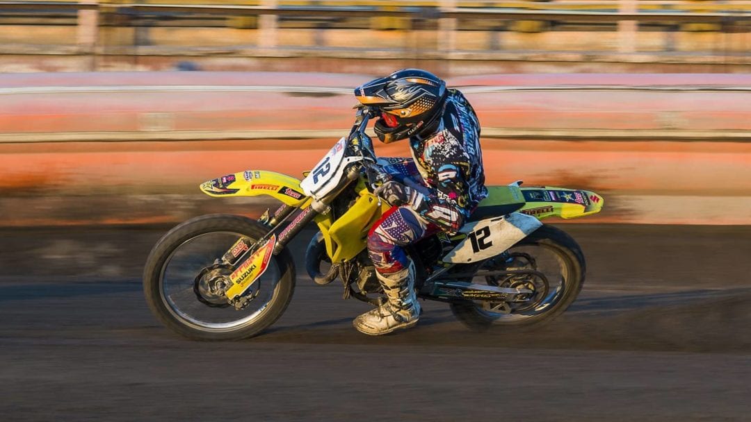 Stuntman Alex Harvill racing his bike in an event