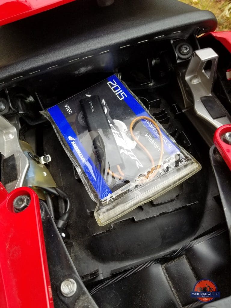GPS tracker in the vinyl bag of owners manual