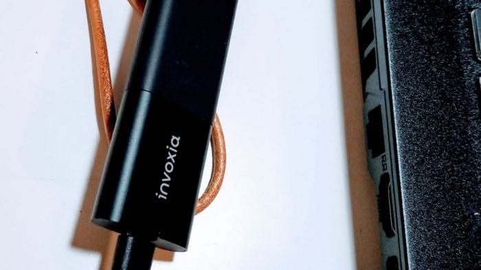 Invoxia GPS tracker getting charged with a micro USB charging cable. Invoxia GPS tracker getting charged with a micro USB charging cable.