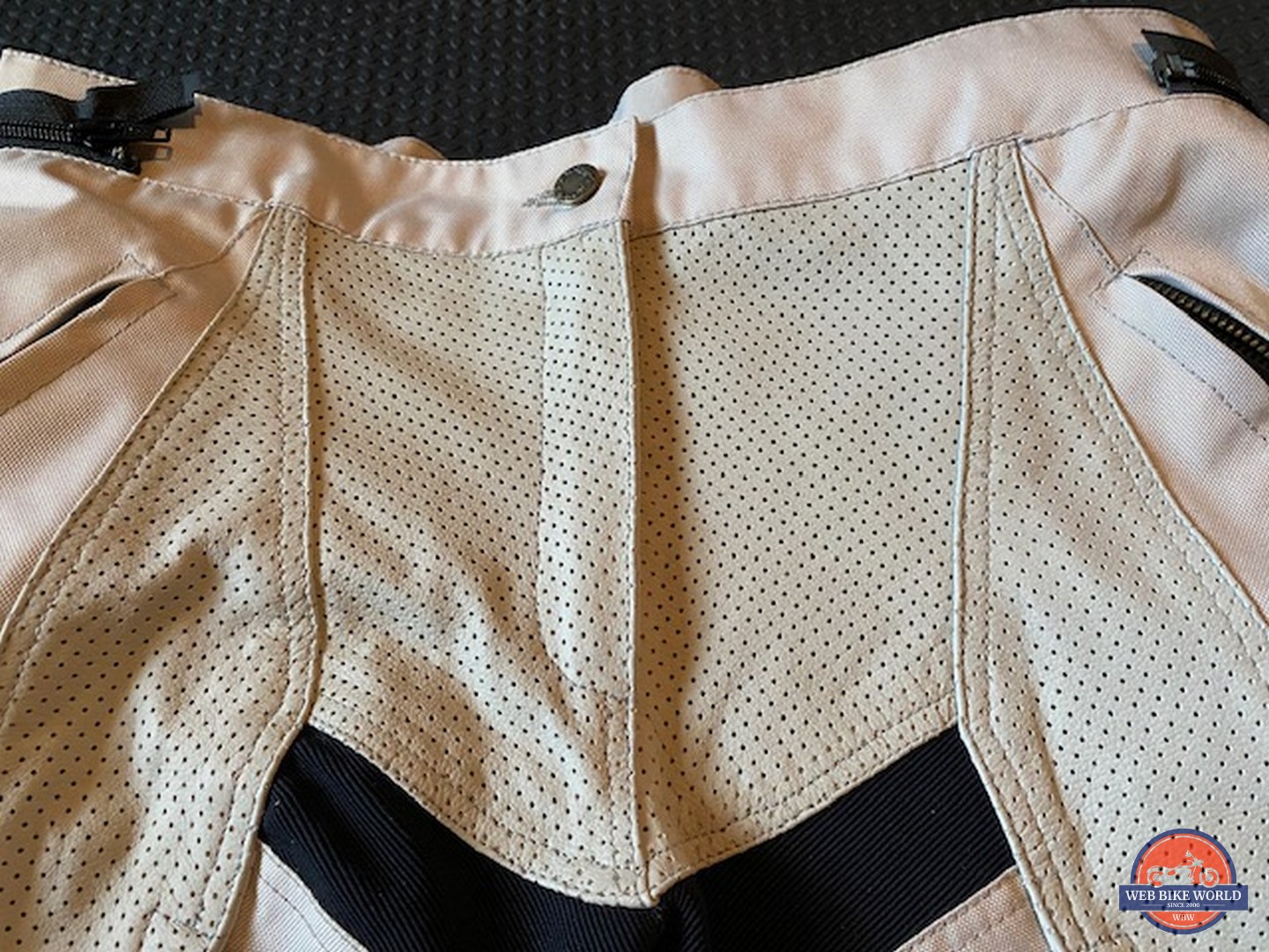Closeup of perforated leather on the Falcon pants