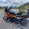 The Shark Spartan GT helmet sitting on the seat of a KTM 790 Adventure in the Canadian Rockies near Canmore, Alberta.