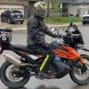 Jim riding a KTM 790 Adventure wearing a Shark Spartan GT Replikan helmet.