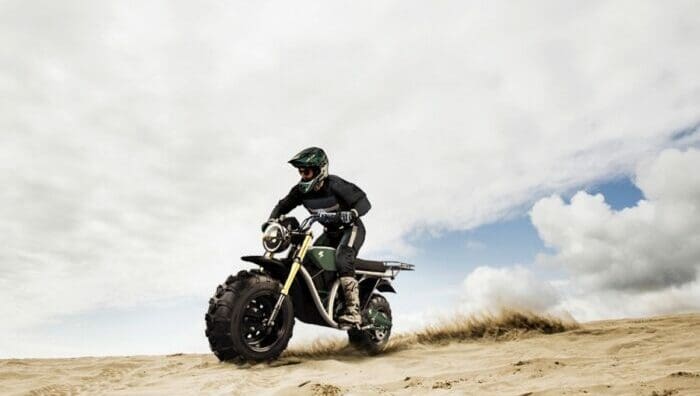 A rider trying out The Grunt, an electric off-roading motorcycle made by Volcon Powersports