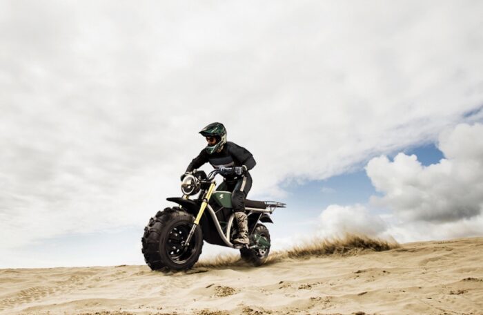 A rider trying out The Grunt, an electric off-roading motorcycle made by Volcon Powersports