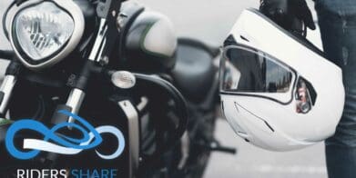 a picture of the side of a motorcycle with a hanging helmet, courtesy of Riders Share Rental Programs