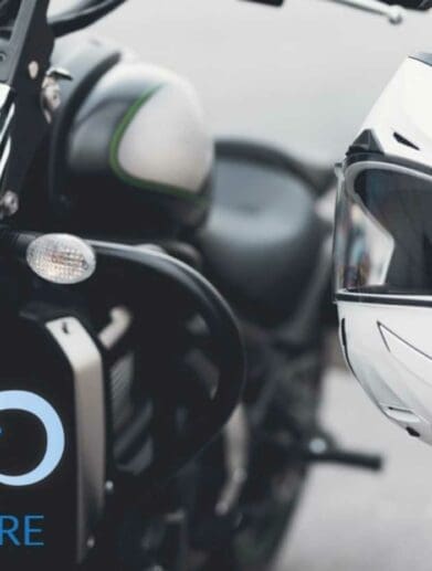 a picture of the side of a motorcycle with a hanging helmet, courtesy of Riders Share Rental Programs