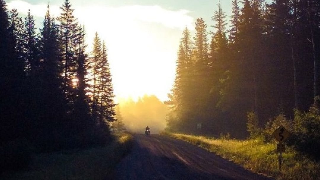 A gorgeous view of a motorcyclist trying out the national forest highway near sturgis, South Dakota