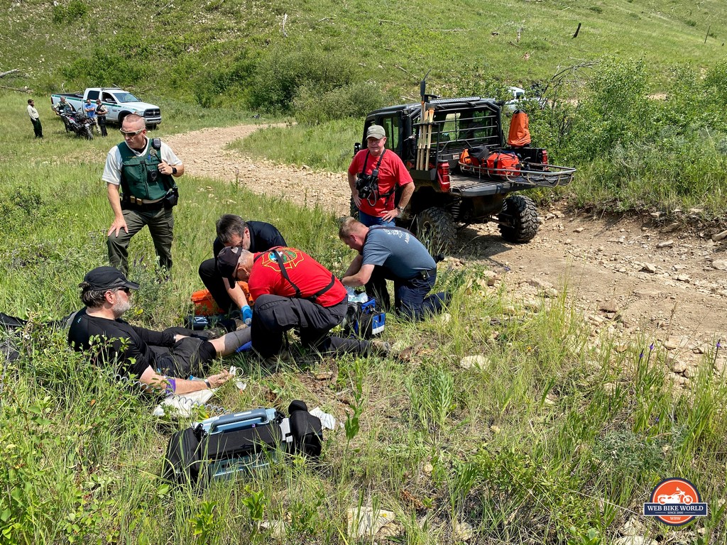 Brian receiving medical aid from paramedics out on the trails near Rapid City, SD.