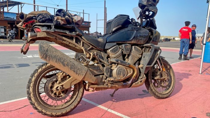A Harley Davidson Pan America covered in mud. A Harley Davidson Pan America covered in mud.