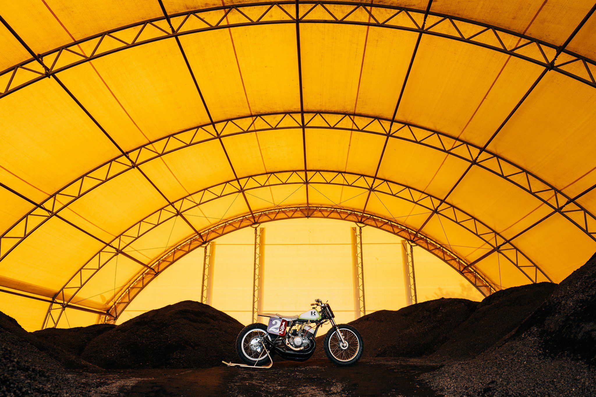 motorcycle parked in a covered gravel quarry in Germany