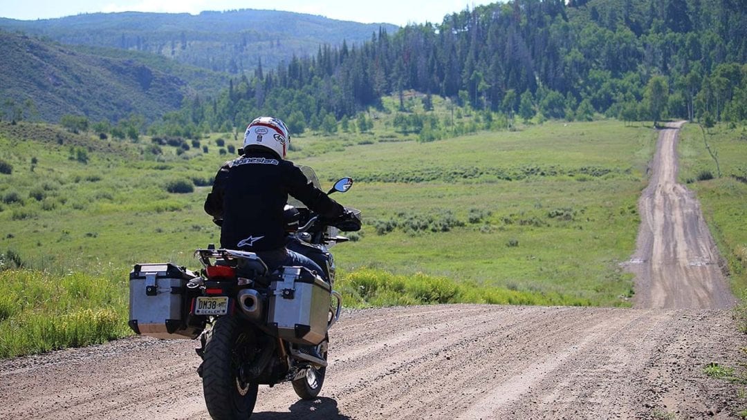 An adventure rider taking advantage of the view in south dakota