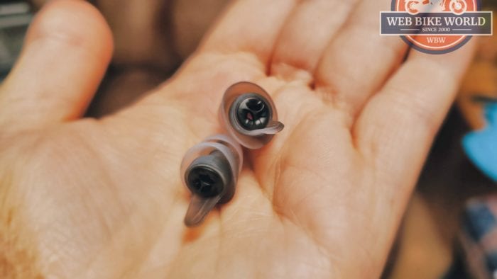 MOTO PRO ear plugs with MAX filters in the palm of a women's hand.