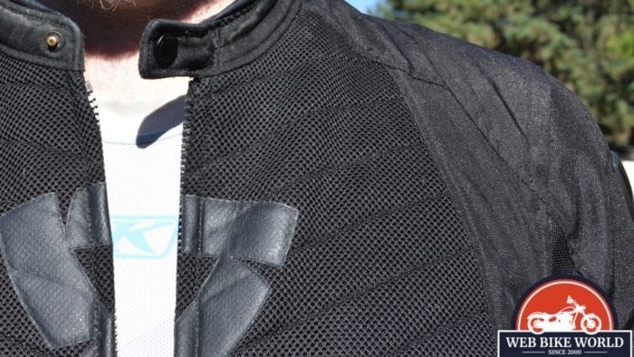 A view of the KLIM Aggressor -1.0 Cooling Shirt underneath the model's usual motorcycle attire. A view of the KLIM Aggressor -1.0 Cooling Shirt underneath the model's usual motorcycle attire.