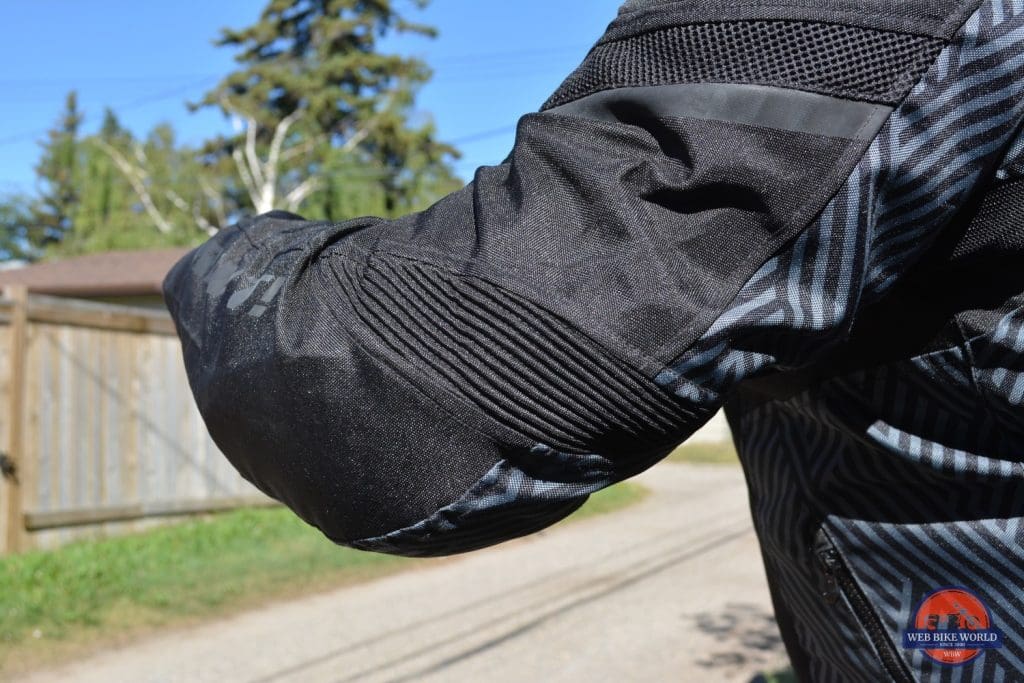 A back left elbow view of the Arc Air Mesh jacket, with focus on the accordion zones