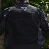 A back view of the Arc Air Mesh jacket, with focus on the visibility points and safety rating
