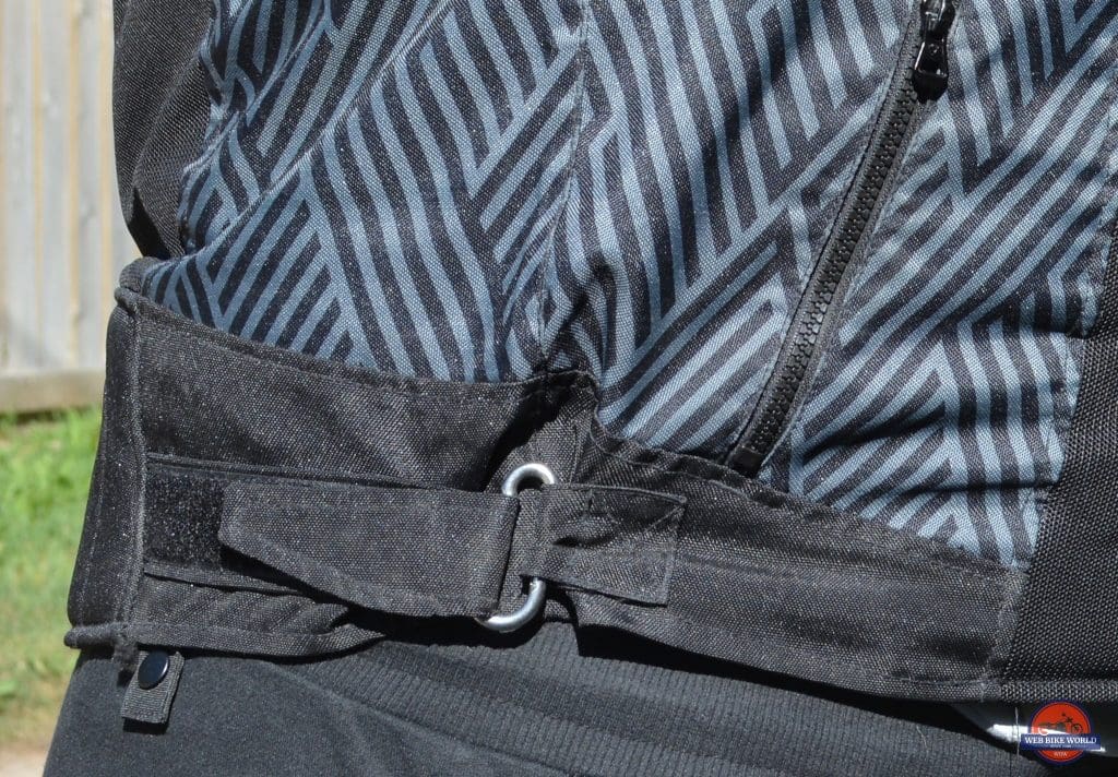 A view of the left buckle on the Arc Air Mesh jacket