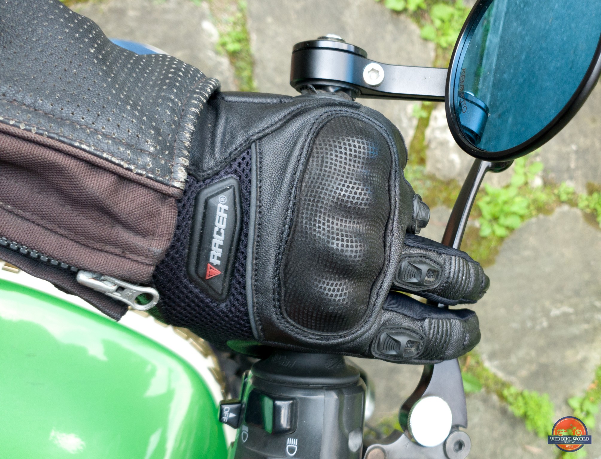 Top down view of Pitlane gloves on motorcycle handlebars