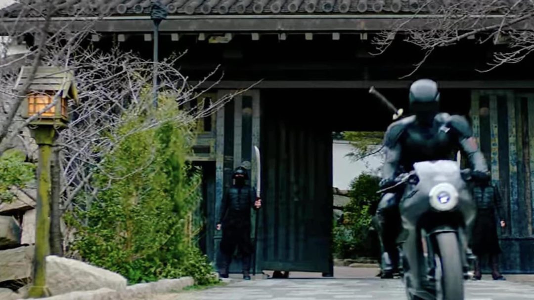 a view of a character riding out of a Japanese house in the action film Snake Eyes: G.I. Joe Origins