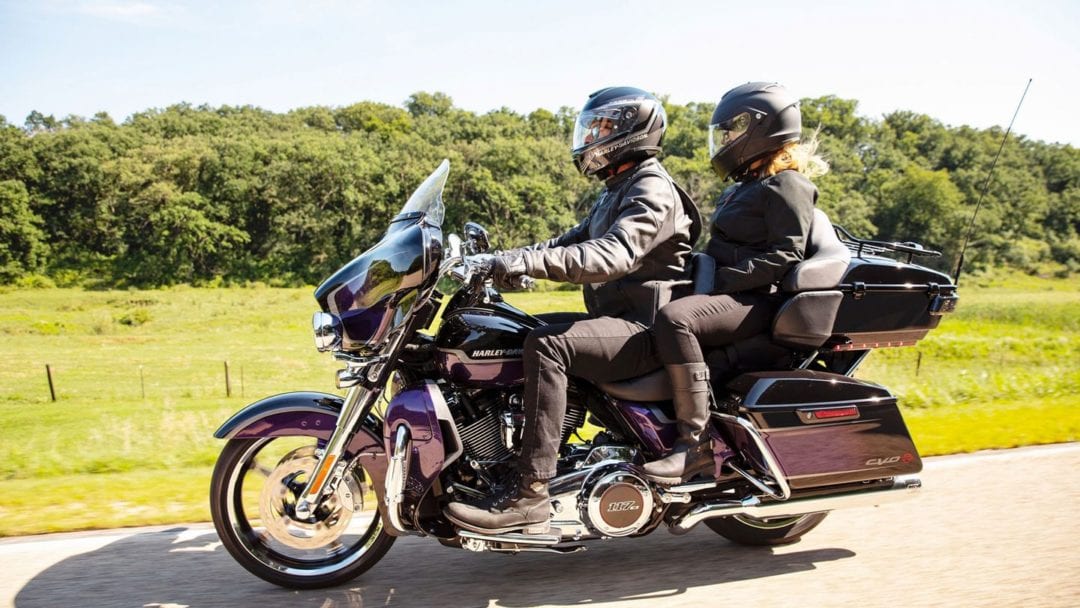 a couple out enjoying the air on a motorcycle - possibly one to be rented with Riders Share peer-to-peer rental platform