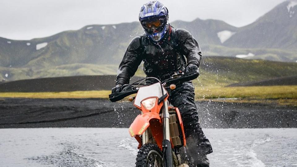 a rider enjoying a wet day on a motorcycle tour by Wild Triumph