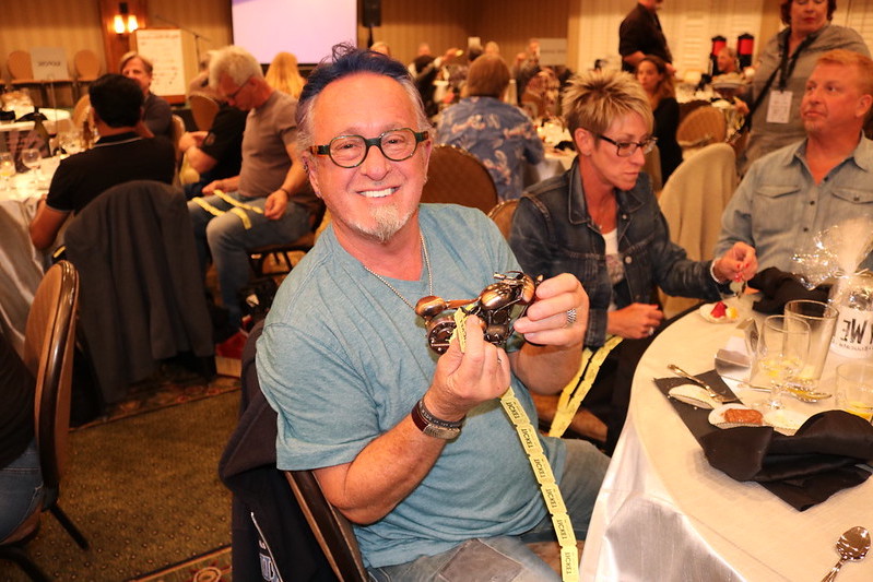 an attendee of the Sturgis Wrap Party enjoys his prize