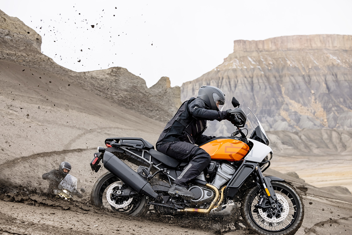 A side view of a rider tricking out on the all-new Harley Davidson Pan America