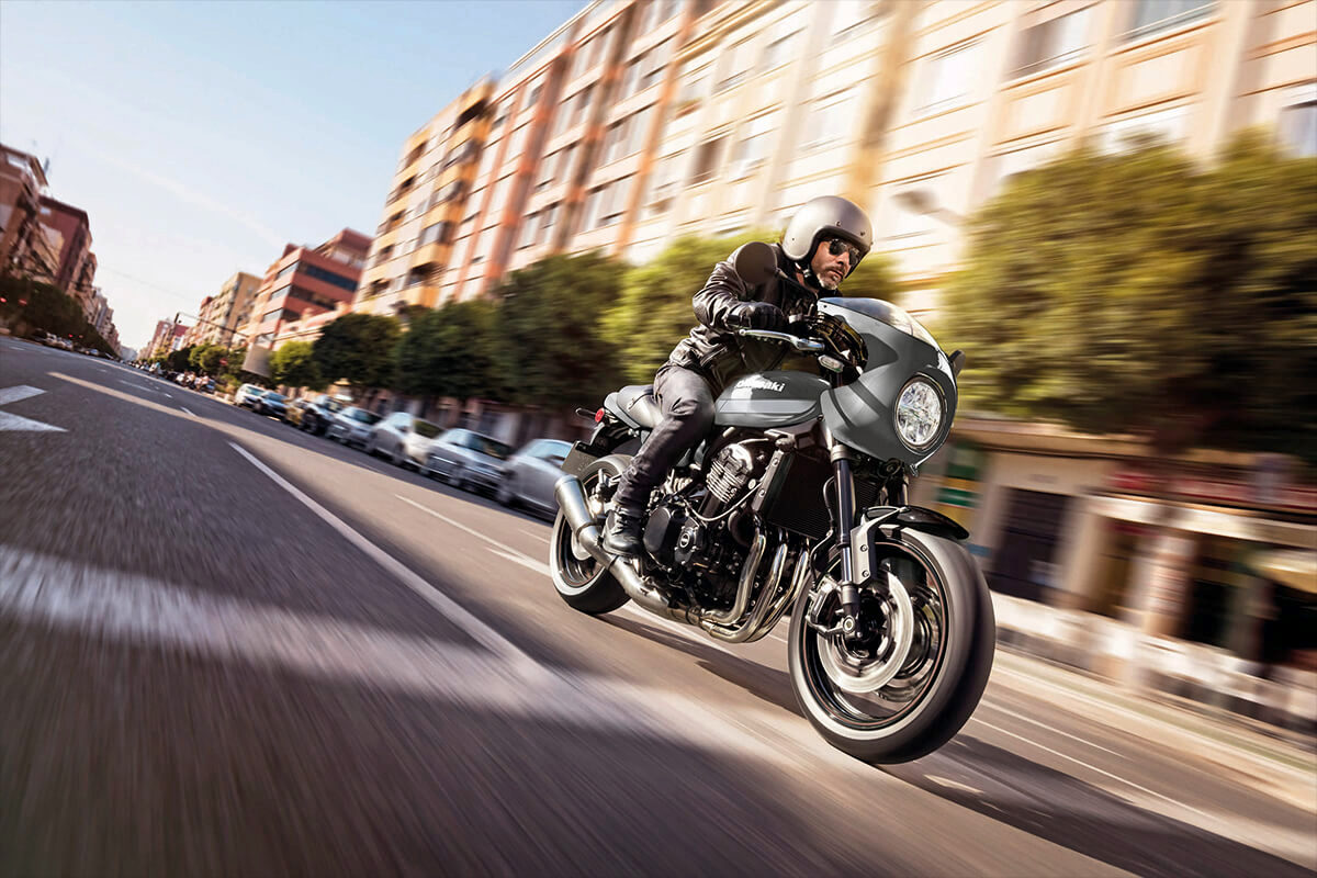 a view of a rider speeding down a road on a Kawasaki Z900RS