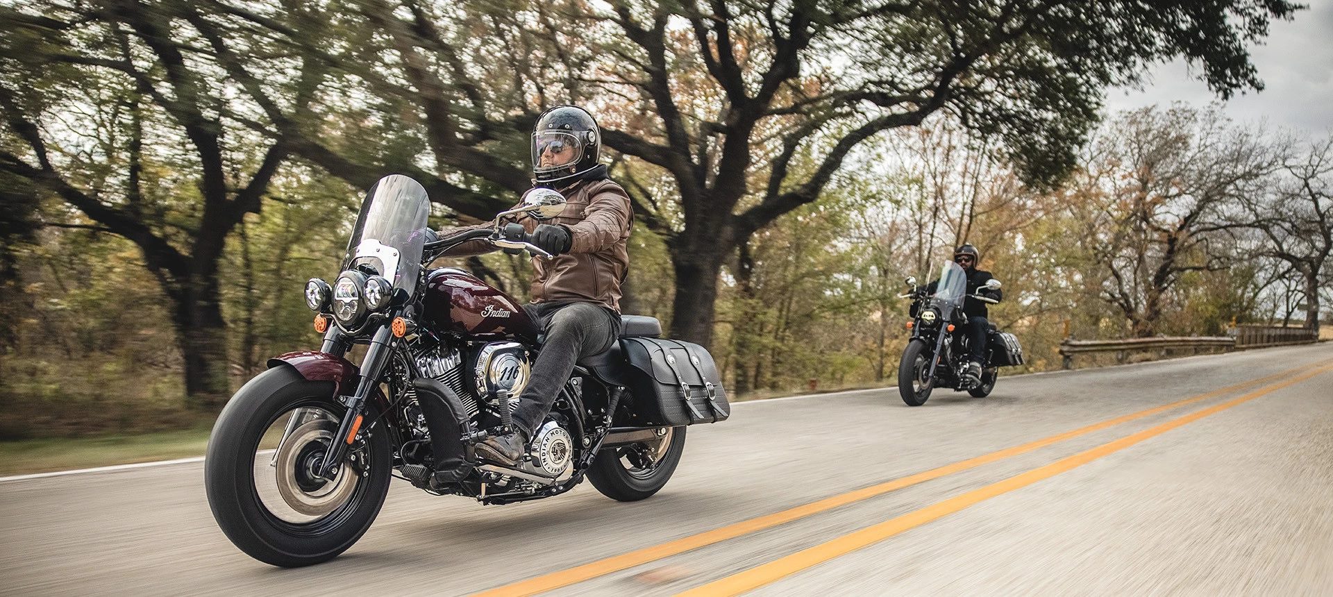 A view of two 2022 Indian Super Chief Limited Edition motorcycles, with riders enjoying the twisting pavement