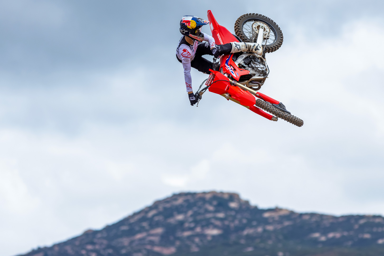 A rider making a jump on the 2022 Honda CRF250R