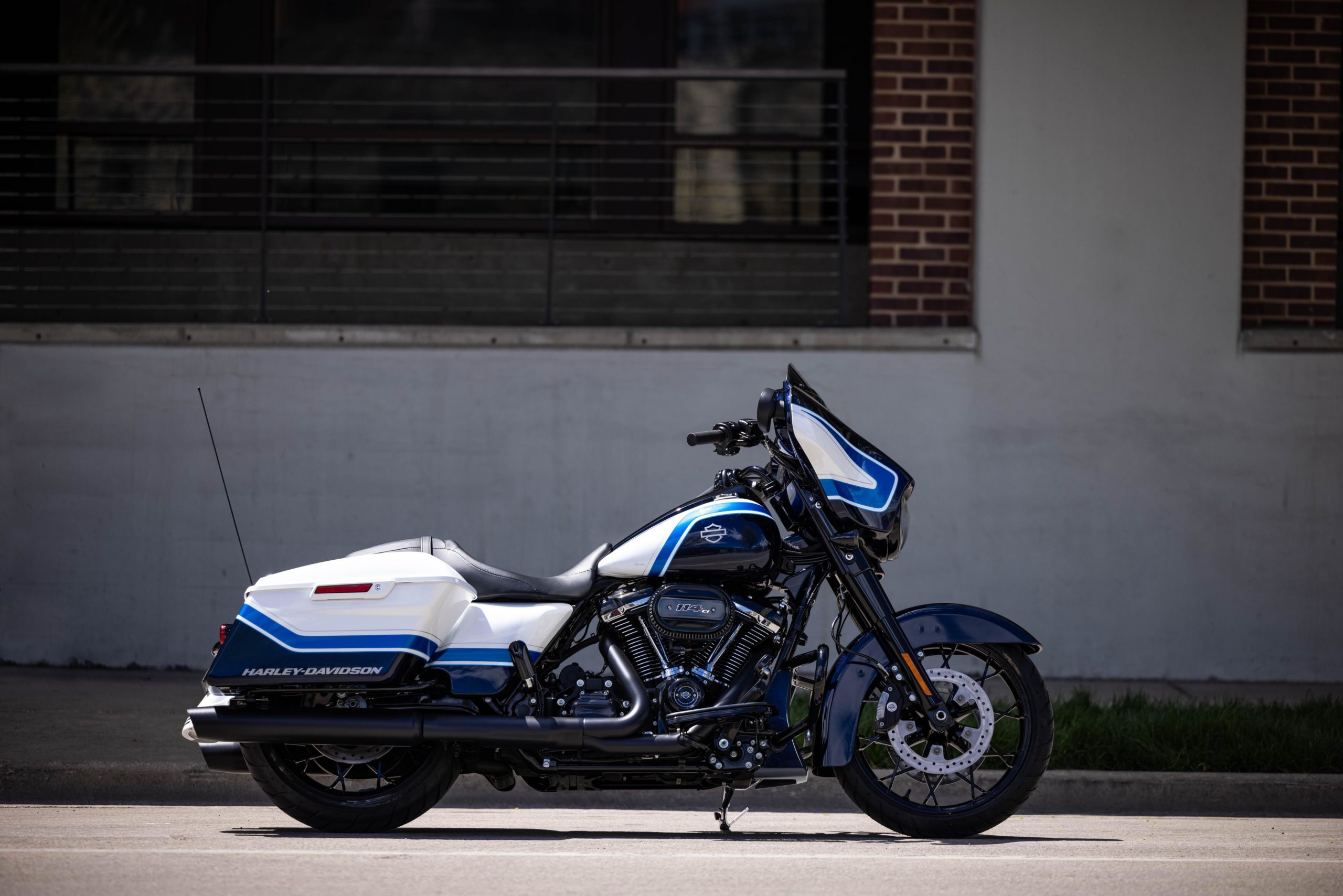 a side view of the all-new 2021 Harley Davidson Street Glider hot-rod bagger in a limited edition Arctic Blast paint job, completed by Gunslinger Custom Paint