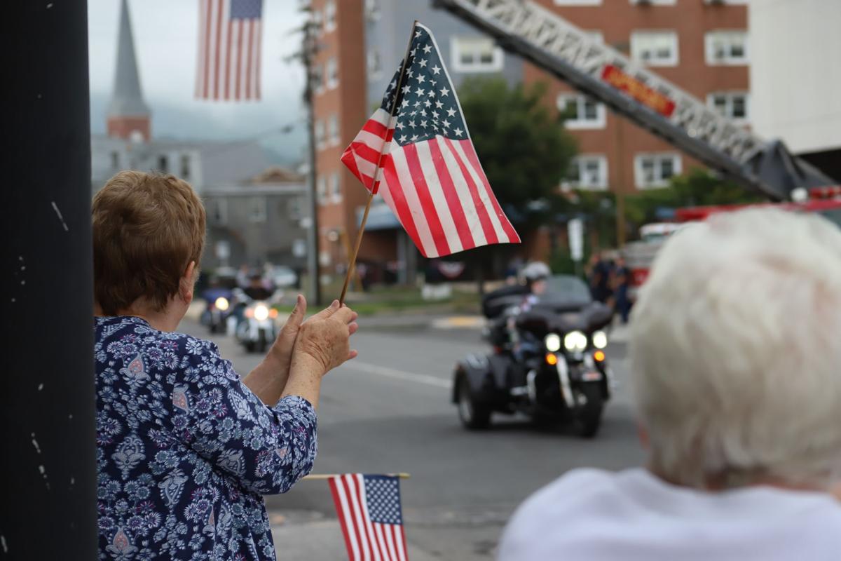 A view of a civilian waving a flag at America's 911 Foundation