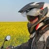Me wearing the BMW GS Pure helmet in front of a canola field.