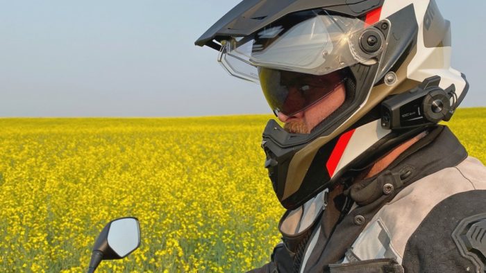 Me wearing the BMW GS Pure helmet in front of a canola field. Me wearing the BMW GS Pure helmet in front of a canola field.