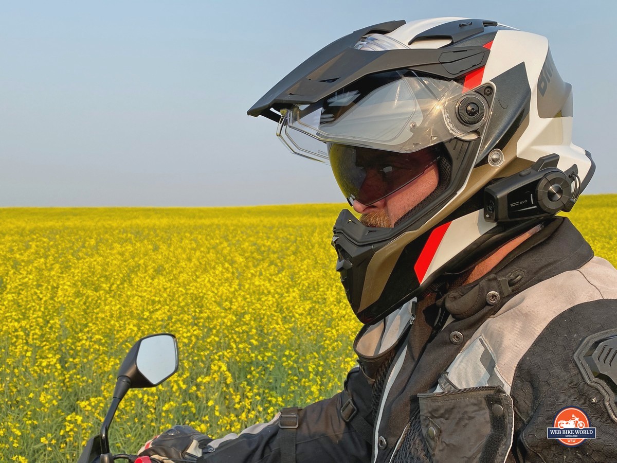 Me wearing the BMW GS Pure helmet in front of a canola field.