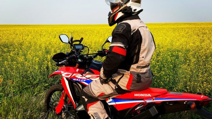 Me sitting on my 2021 Honda CRF300L Rally ABS in front of a canola field. Me sitting on my 2021 Honda CRF300L Rally ABS in front of a canola field.