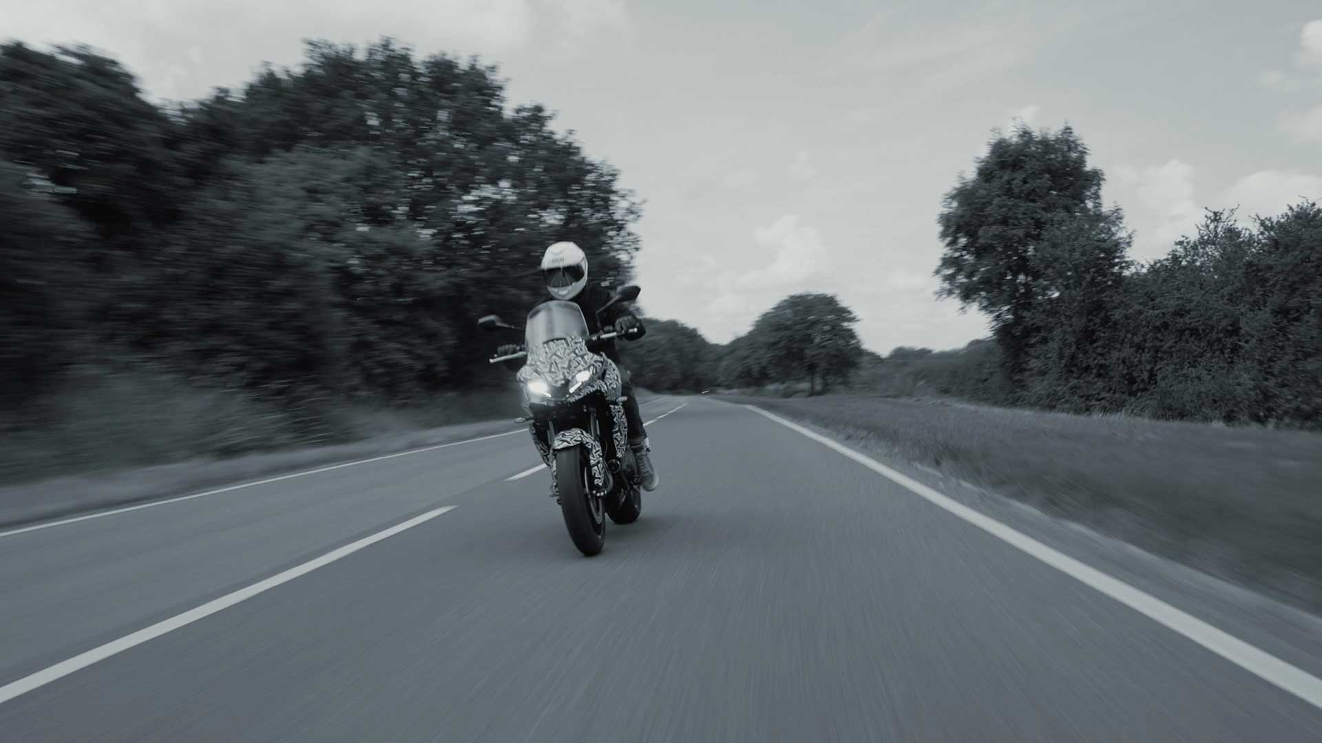 A blurry view of a rider enjoying the new Triumph Tiger prototype, features in a Triumph Tiger Tease release from the UK company.